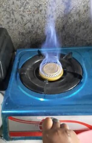Blue flame on a Biospark biogas cooking stove